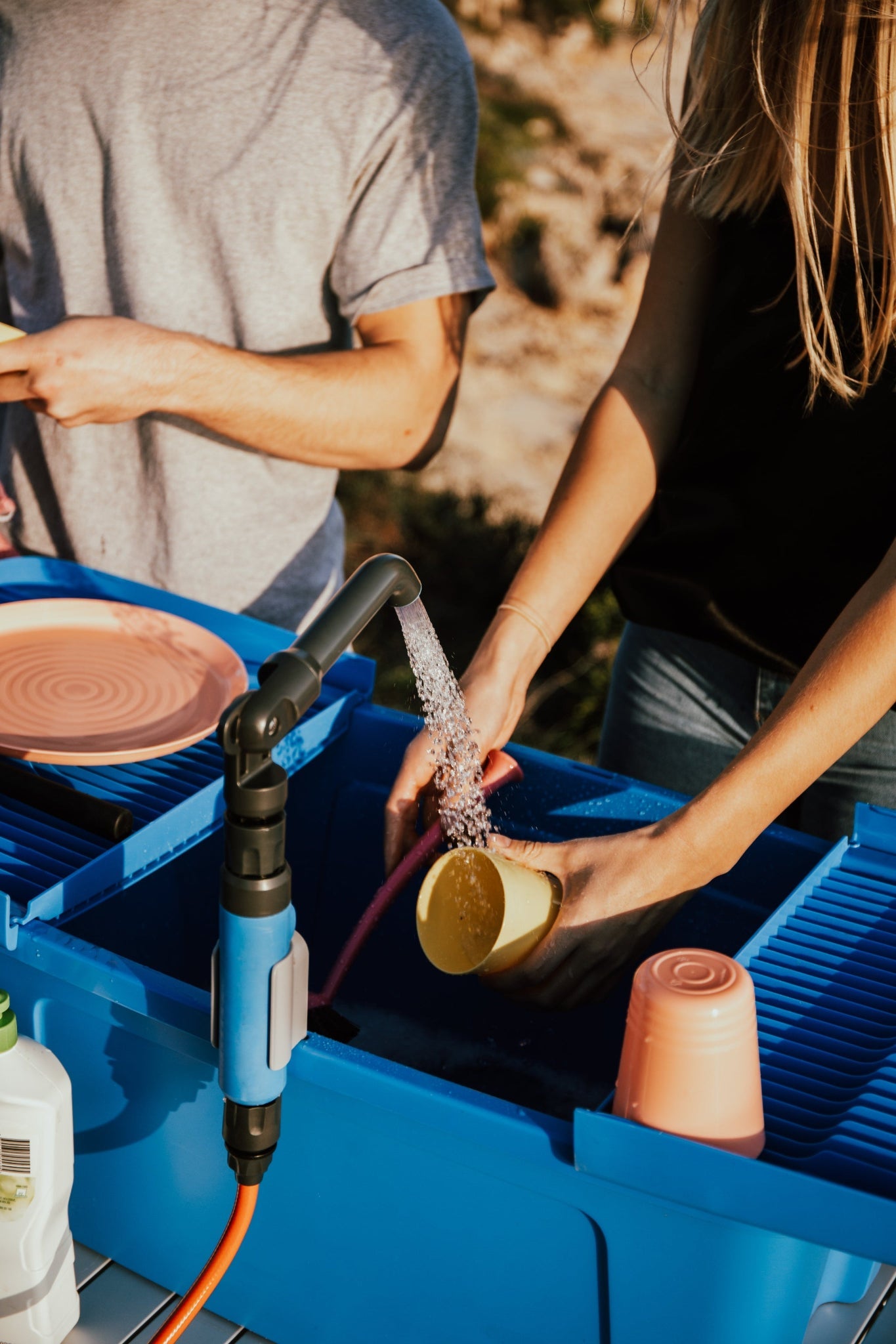 washing dishes in nomad sink
